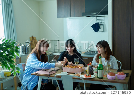 Women enjoying a home party 127146920