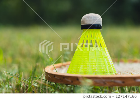 Wooden badminton rackets and shuttlecocks soft focus concept. Copy space Summer outdoor activities. Staycation leisure Wooden badminton rackets and shuttlecocks soft focus concept. Copy space Summer outdoor activities. Staycation leisure 127147166