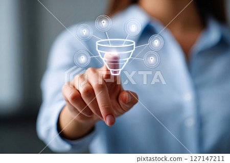 Businesswoman mapping digital marketing funnel via virtual touchscreen, modern strategy concept 127147211