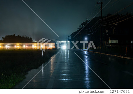 Greenhouse at night, light on the way home Greenhouse at night, light on the way home 127147651
