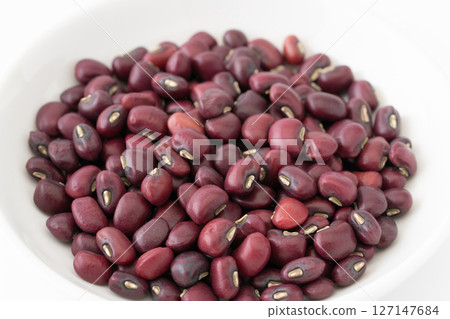 Offerings in a plate 127147684