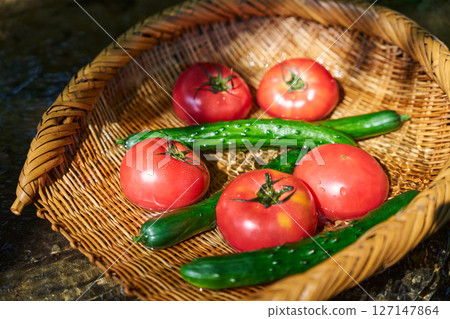 Cooling summer vegetables with stream water 127147864