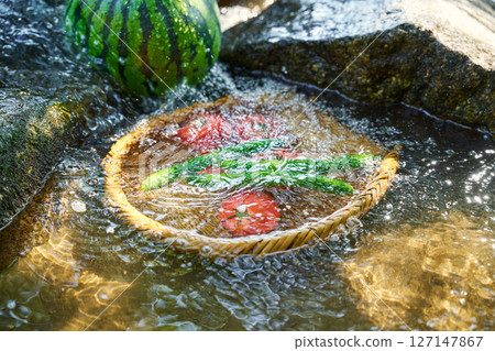 Cool summer vegetables and watermelon with stream water 127147867