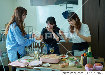 Women preparing for a home party Women preparing for a home party 127147966