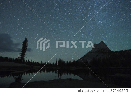 A spectacular view of the John Muir Trail. Starry sky, Cathedral Lake and Cathedral Peak A spectacular view of the John Muir Trail. Starry sky, Cathedral Lake and Cathedral Peak 127149255