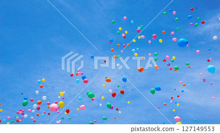 Many colorful balloons flying in the blue sky 127149553