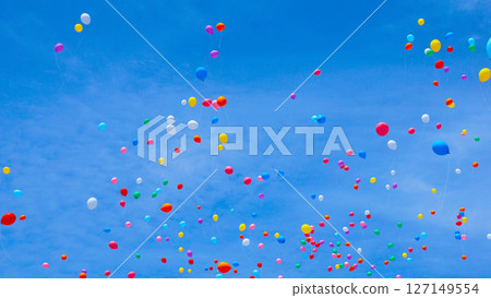 Many colorful balloons flying in the blue sky Many colorful balloons flying in the blue sky 127149554
