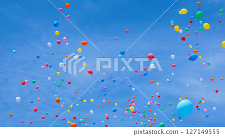 Many colorful balloons flying in the blue sky 127149555