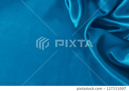 Blue fabric cloth texture for background and design art work, beautiful crumpled pattern of silk or linen. 127151097