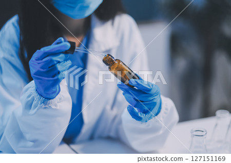 Research, experiment and medical trial being done by a scientist in a lab, science facility or hospital. One young, serious and professional researcher organizing, sorting or making a discovery Research, experiment and medical trial being done by a scientist in a lab, science facility or hospital. One young, serious and professional researcher organizing, sorting or making a discovery 127151169