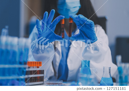 Research, experiment and medical trial being done by a scientist in a lab, science facility or hospital. One young, serious and professional researcher organizing, sorting or making a discovery Research, experiment and medical trial being done by a scientist in a lab, science facility or hospital. One young, serious and professional researcher organizing, sorting or making a discovery 127151181