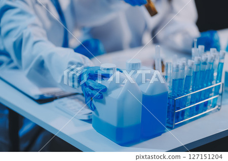 Research, experiment and medical trial being done by a scientist in a lab, science facility or hospital. One young, serious and professional researcher organizing, sorting or making a discovery Research, experiment and medical trial being done by a scientist in a lab, science facility or hospital. One young, serious and professional researcher organizing, sorting or making a discovery 127151204