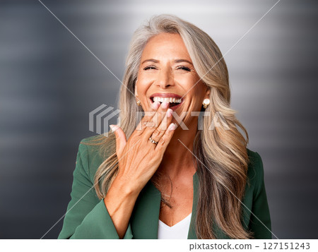 Middle-aged woman laughing Middle-aged woman laughing 127151243