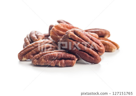 Peeled pecan nuts isolated on white background. Peeled pecan nuts isolated on white background. 127151765