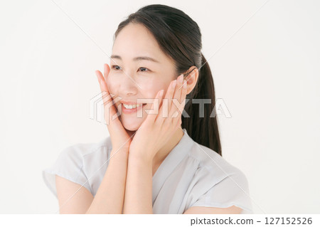 A woman in her twenties doing skin care A woman in her twenties doing skin care 127152526