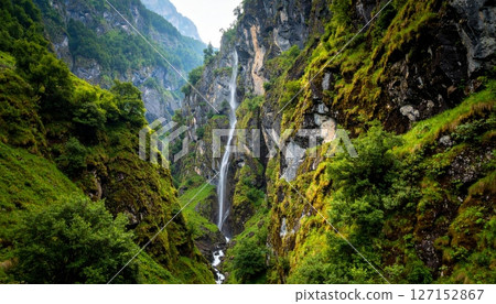 mountain waterfall in a green summer landscape with flowing water 127152867