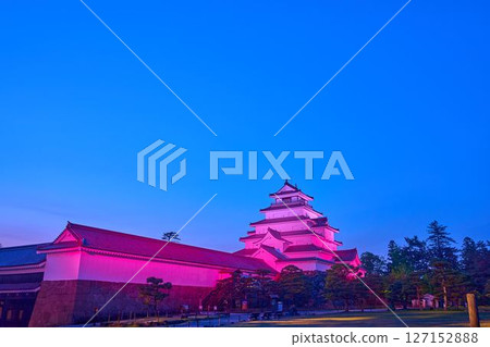 Illuminated Tsuruga Castle in Aizuwakamatsu, Fukushima Prefecture, seen from the south side of the park just after sunset 127152888