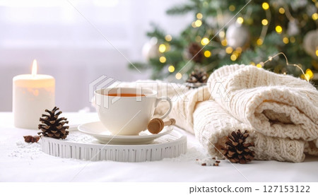 Hot Christmas coffee with sweet cookies on a snowy table 127153122
