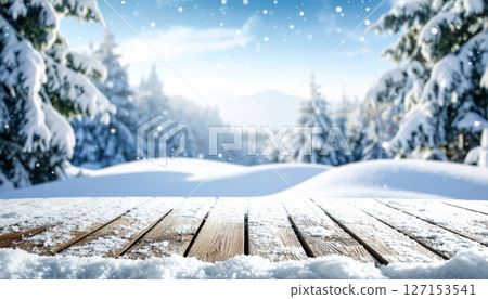 Snowy winter forest landscape with frozen trees and white mountains under a blue sky 127153541