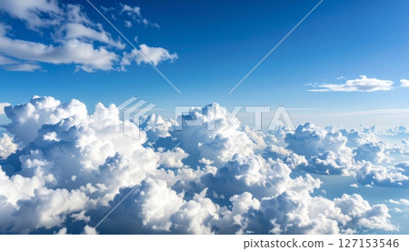 Beautiful bright blue sky with fluffy white cumulus clouds Beautiful bright blue sky with fluffy white cumulus clouds 127153546