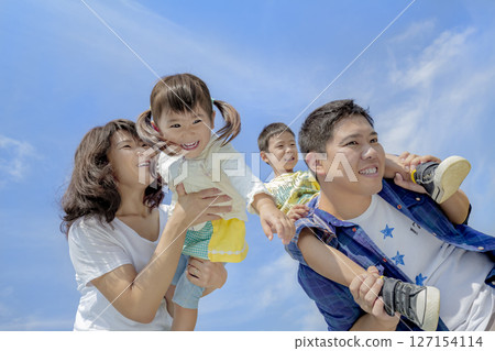 Four people playing in the park 127154114