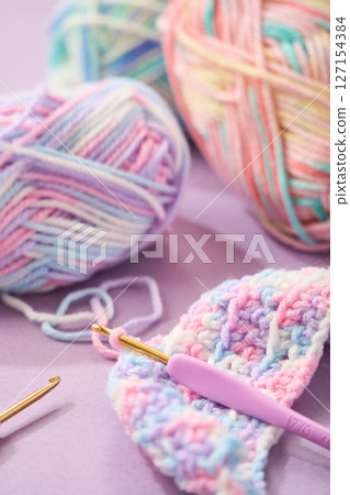 Image of crocheting with pastel colored yarn 127154384