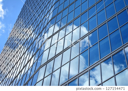 Modern sustainable glass office buildings. Exterior view of corporate headquarters glass buildings architecture.Glass windows in energy-efficient buildings. Financial business center buildings. Modern sustainable glass office buildings. Exterior view of corporate headquarters glass buildings architecture.Glass windows in energy-efficient buildings. Financial business center buildings. 127154471