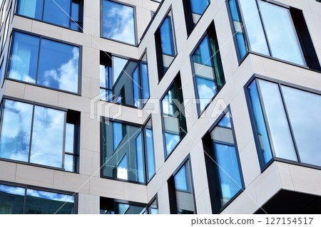 Modern sustainable glass office buildings. Exterior view of corporate headquarters glass buildings architecture.Glass windows in energy-efficient buildings. Financial business center buildings. Modern sustainable glass office buildings. Exterior view of corporate headquarters glass buildings architecture.Glass windows in energy-efficient buildings. Financial business center buildings. 127154517