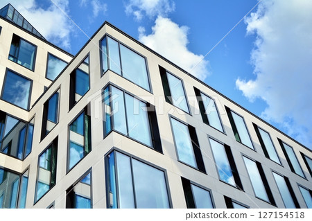 Modern sustainable glass office buildings. Exterior view of corporate headquarters glass buildings architecture.Glass windows in energy-efficient buildings. Financial business center buildings. Modern sustainable glass office buildings. Exterior view of corporate headquarters glass buildings architecture.Glass windows in energy-efficient buildings. Financial business center buildings. 127154518