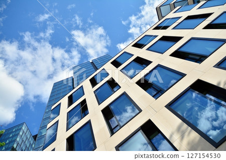 Modern sustainable glass office buildings. Exterior view of corporate headquarters glass buildings architecture.Glass windows in energy-efficient buildings. Financial business center buildings.  127154530