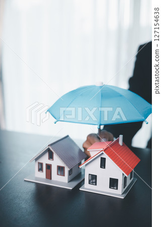 Concept business house finance protection office plan investment buy sell home ensuring idea financial security. residence agent hand protect purchase insurance and secure favorable loan deal. 127154638