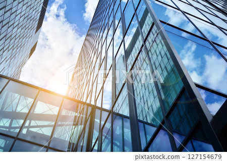 Modern sustainable glass office buildings. Exterior view of corporate headquarters glass buildings architecture.Glass windows in energy-efficient buildings. Financial business center buildings. Modern sustainable glass office buildings. Exterior view of corporate headquarters glass buildings architecture.Glass windows in energy-efficient buildings. Financial business center buildings. 127154679