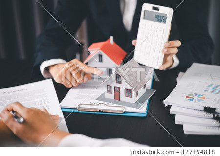 Concept business house finance protection office plan investment buy sell home ensuring idea financial security. residence agent hand protect purchase insurance and secure favorable loan deal. 127154818