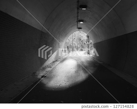 The exit of a small tunnel. Monochrome. The exit of a small tunnel. Monochrome. 127154828