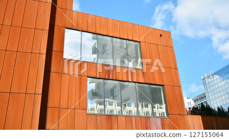 Modern sustainable glass office buildings. Exterior view of corporate headquarters glass buildings architecture.Glass windows in energy-efficient buildings. Financial business center buildings.  127155064