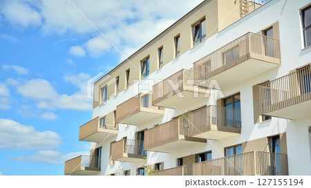 Modern new residential apartment house building complex. Exterior view of modern apartment building. New construction apartment or condo complex. 127155194