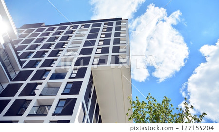 Modern new residential apartment house building complex. Exterior view of modern apartment building. New construction apartment or condo complex. 127155204