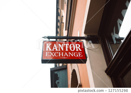 Currency Exchange Office Sign on Building 127155298