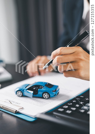 Concept business vehicle finance protection office plan investment buy sell car ensuring idea financial security. automobile agent hand protect purchase insurance and secure favorable loan deal. 127155355