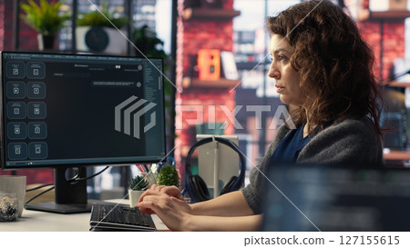 Female freelancer uses online AI assistant to automate text generation and solve tasks easily, enhance productivity at the office. Integration of advanced algorithms and digital tools. Camera B. 127155615