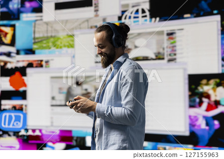 Young influencer enjoying online web connection between followers, highlighting real time engagement, online presence and imagination as essential elements of influence and communication. 127155963