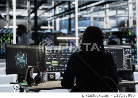 Server room engineer using artificial intelligence to enhance operational efficiency and reduce downtime. Admin AI driven solutions for data center infrastructure using node trees on PC 127155990