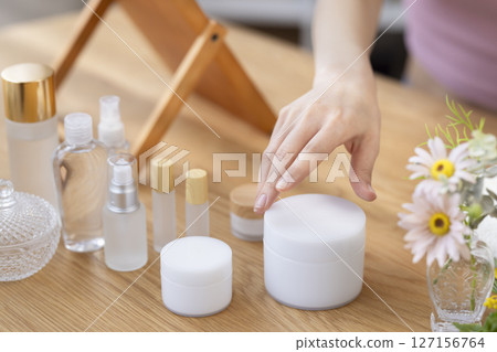 Beauty image: A woman's hand holding cosmetics 127156764
