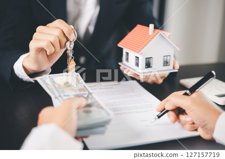 Concept business house finance protection office plan investment buy sell home ensuring idea financial security. residence agent hand protect purchase insurance and secure favorable loan deal. 127157719
