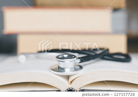 Concept business education essential idea globalization, student learn and study in university and colleges to master knowledge needed travel global economy. book stethoscope for medical health care 127157728