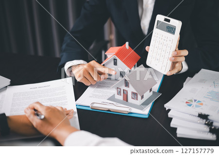 Concept business house finance protection office plan investment buy sell home ensuring idea financial security. residence agent hand protect purchase insurance and secure favorable loan deal. 127157779