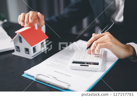 Concept business house finance protection office plan investment buy sell home ensuring idea financial security. residence agent hand protect purchase insurance and secure favorable loan deal. 127157781