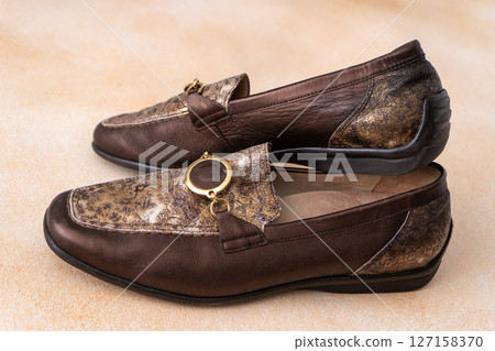 Pair of leather shoes. Brown classic moccasins. Loafer footwear. Pair of leather shoes. Brown classic moccasins. Loafer footwear. 127158370