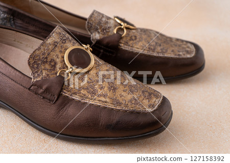 Pair of leather shoes. Brown classic moccasins. Loafers footwear 127158392