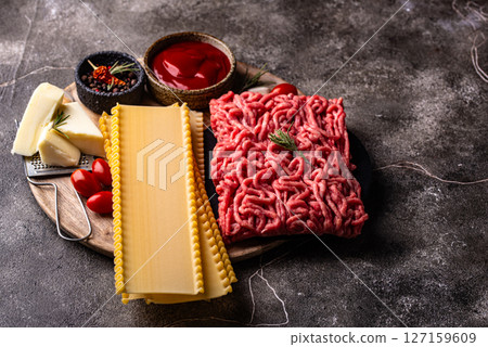 Ingredients for cooking lasagna bolognese with bechamel Ingredients for cooking lasagna bolognese with bechamel 127159609